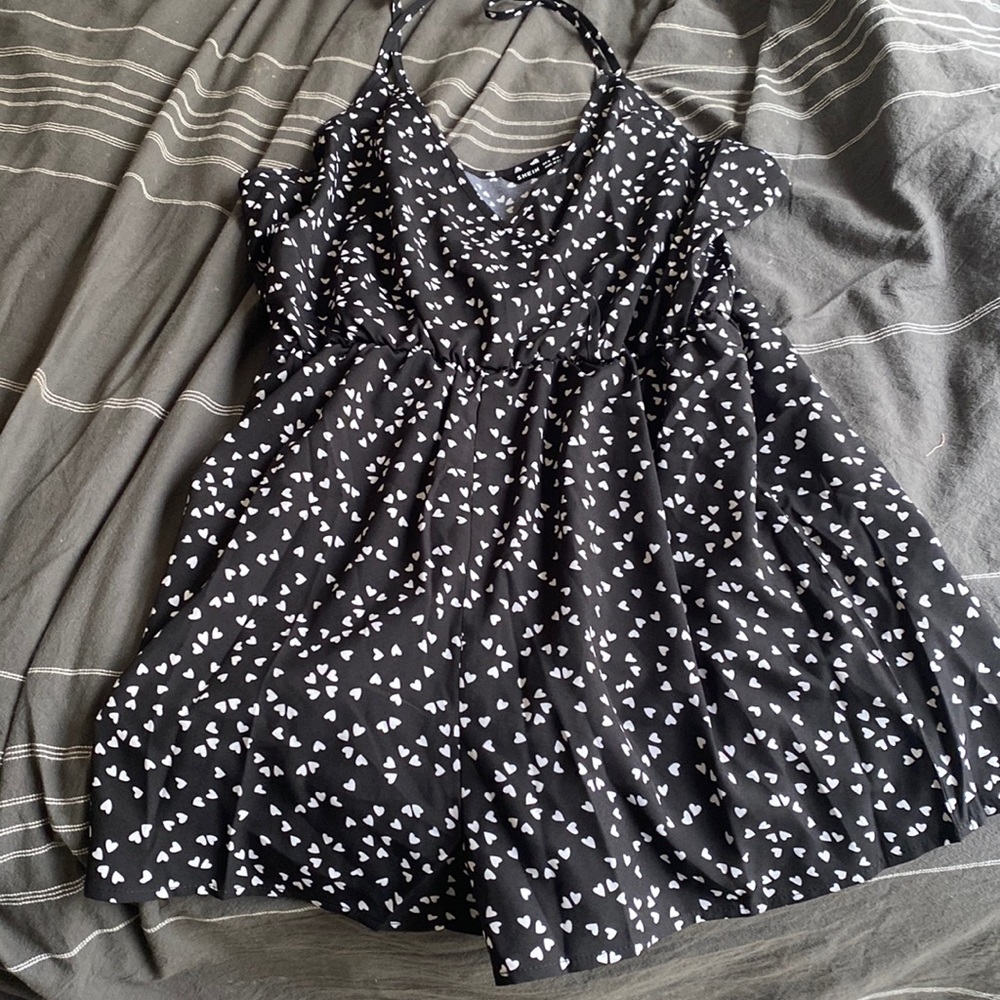 I am selling my SHEIN heart print romper. This black romper is a size XL.